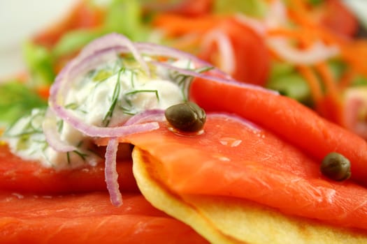 Corn fritters topped with smoked trout with dill, capers and cottage cheese.