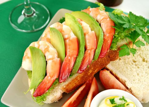 Delightful fresh shrimp and avocado open sandwich with lemon mayonnaise.