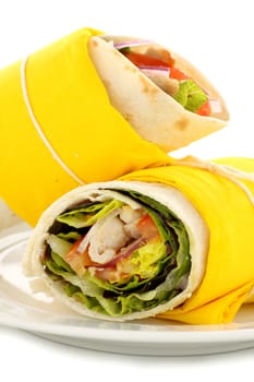 Delicious spicy chicken wraps in tortillas ready to serve.