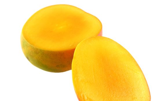 Fresh colorful mango sliced in half.