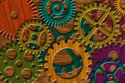 Colorful Wooden Gears on Wood Grain Texture Background