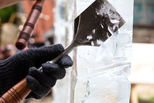 Ice Carver Using Chisel to Carve