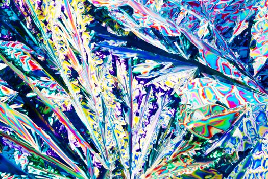 Colorful appearance of crystals of tartaric acid, one of many compounds found in grapes and wine, in polarized light.