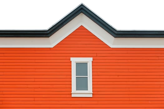 Orange building facade with window and fancy roof trim as architecture background pattern abstract