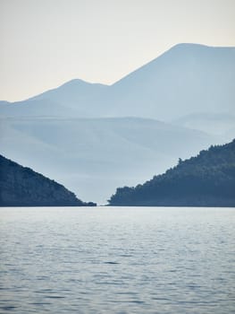 Coast in morning mist, berween two islands        