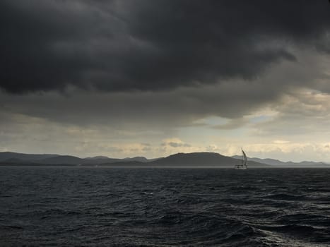 Storm. islands and sailing boat in Adriatic sea, Croatia