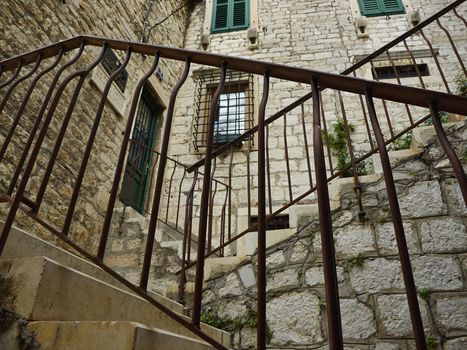 Stairs with metal brackets in old town Shibenik       