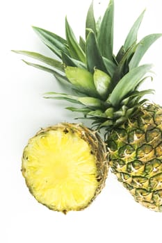 Ripe pineapple with slices isolated on white background