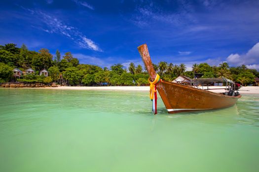 Longtaill boat and turquoise water at tropical beach