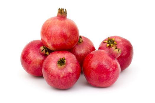 fresh pomegranates on white background