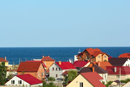 Colored roofs at the seaside with clear blue sky