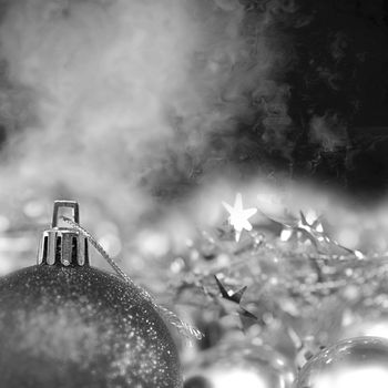 background bright christmas ornaments ball with selective focus on black and white and dark space to write message