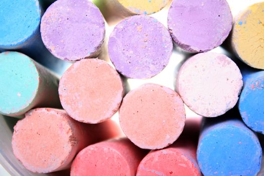 several colorful chalks as a background images 