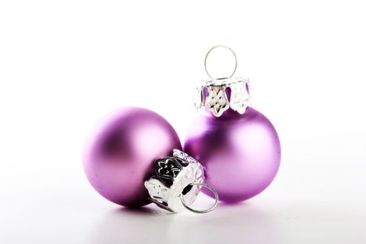 two beautiful pink christmas balls white background 