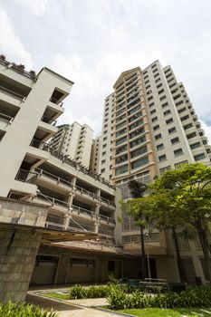 Vertical low angle shot of a residential estate with car park. 