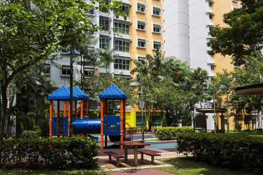 Residential estate with playrground on the foreground.