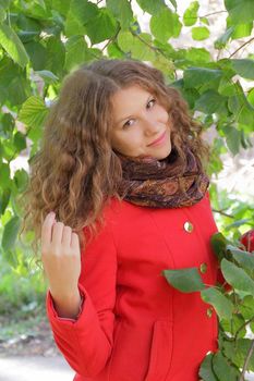 Image of beautiful young woman in red coat