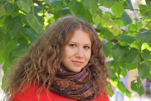 Image of beautiful young woman in red coat