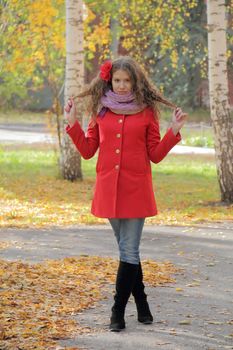 Image of beautiful young woman in red coat