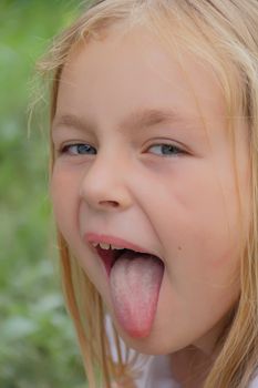 Portrait of girl with smile and makes faces