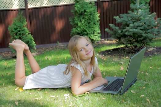 Image of girl with laptop in summer