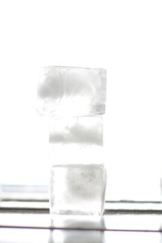 several ice cubes in the form of ground with white background 