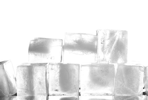 several ice cubes in the form of ground with white background 
