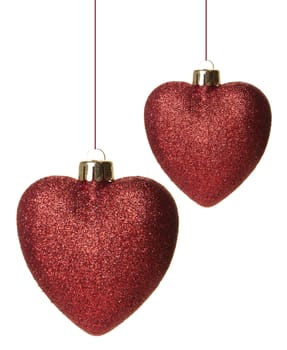 red christmas balls as heart hanging isolated 