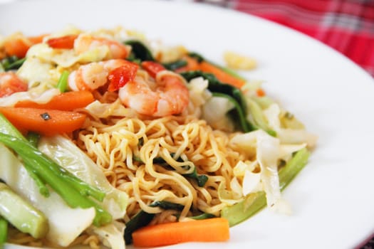 Trhaditional vietnam Noodles with shrimps and vegetables on plate