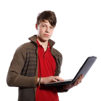 Teenager with a personal computer on a white background