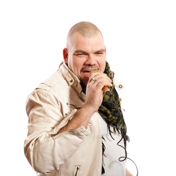 middle age  man sings into a microphone on a white background