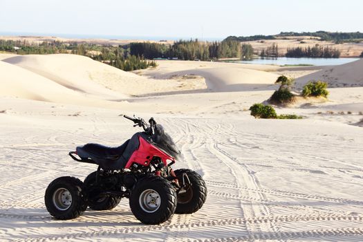 Quad bike in sand desert close-up