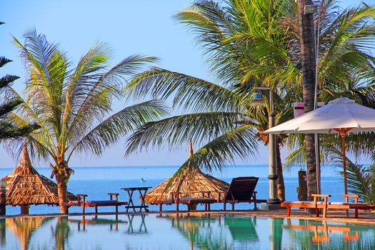 Pool on a tropical beach - vacation background