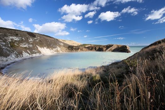 Idyllic Lulworth Cove famous UK landmark coastline