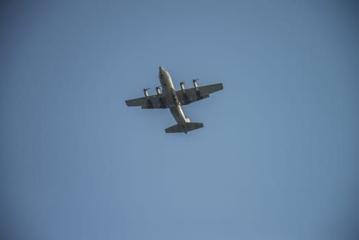 Four-engine propeller aircraft in the air. The pictures of the planes are shot very close an airport just before landing. September 2013.