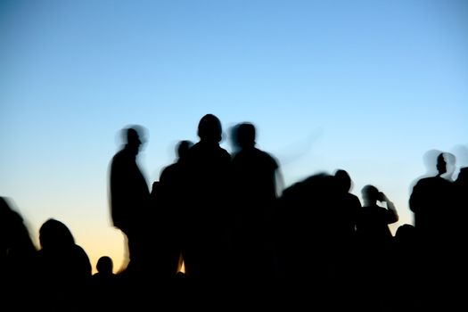 people silhouettes  on nemrut mountain waiting sunrise