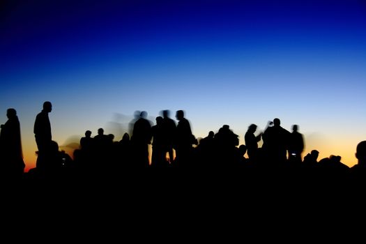 people silhouettes  on nemrut mountain waiting sunrise