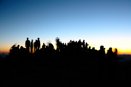 people silhouettes  on nemrut mountain waiting sunrise