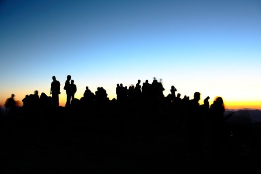 people silhouettes  on nemrut mountain waiting sunrise