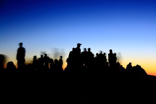 people silhouettes  on nemrut mountain waiting sunrise