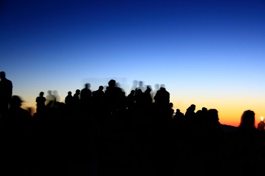 people silhouettes  on nemrut mountain waiting sunrise