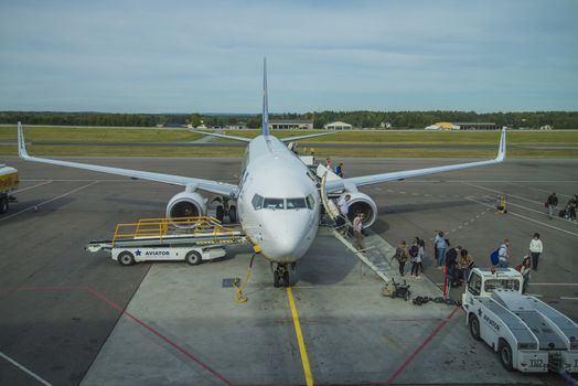 Passengers disembarking. Image is shot at Moss Airport Rygge, Norway. September 2013.