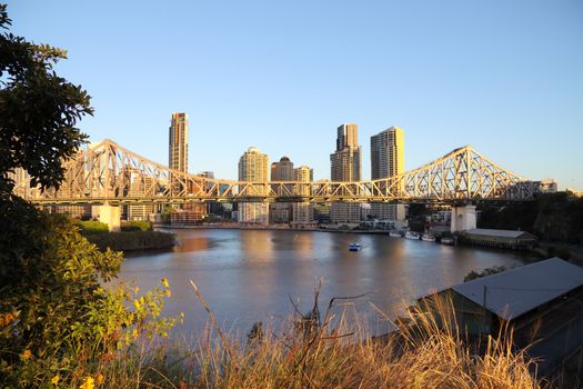 Story Bridge and the Brisbane city skyline in Australia in the early morning light.