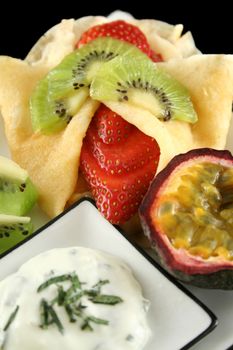 Strawberry filled pancake with passionfruit and minted yogurt.