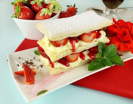 Delicious strawberry mille feuille with fresh strawberries and Vienna coffee.