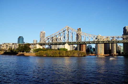 The iconic Story Bridge spanning the Brisbane River in Brisbane Australia at sunrise.