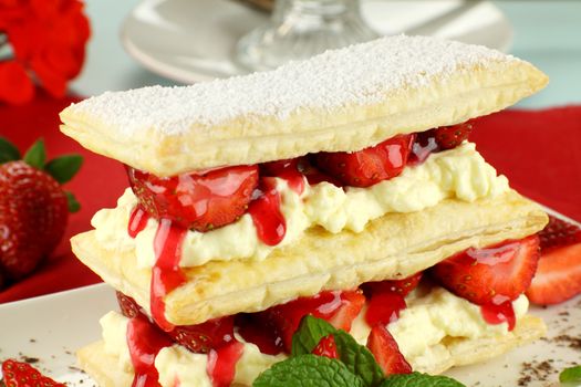 Delicious strawberry mille feuille with fresh strawberries and Vienna coffee.