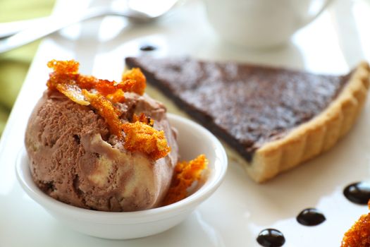 Caramel ice cream with honeycomb and chocolate tart with sauce.