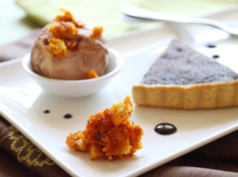 Sweet baked honeycomb with caramel ice cream and chocolate tart.