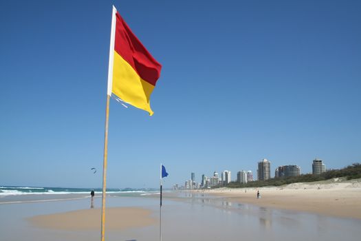 Swimming safety flags on the Gold Coast Northern beach looking towards Surfers Paradise.